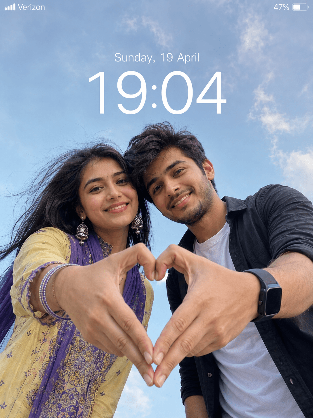 Couple: Heart-shaped hands in the sky